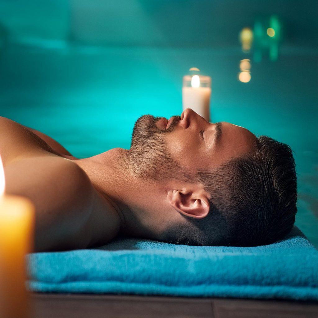 Firefly a person lying with there back up in a spa is illuminated by the candlelight, hands and head (2)